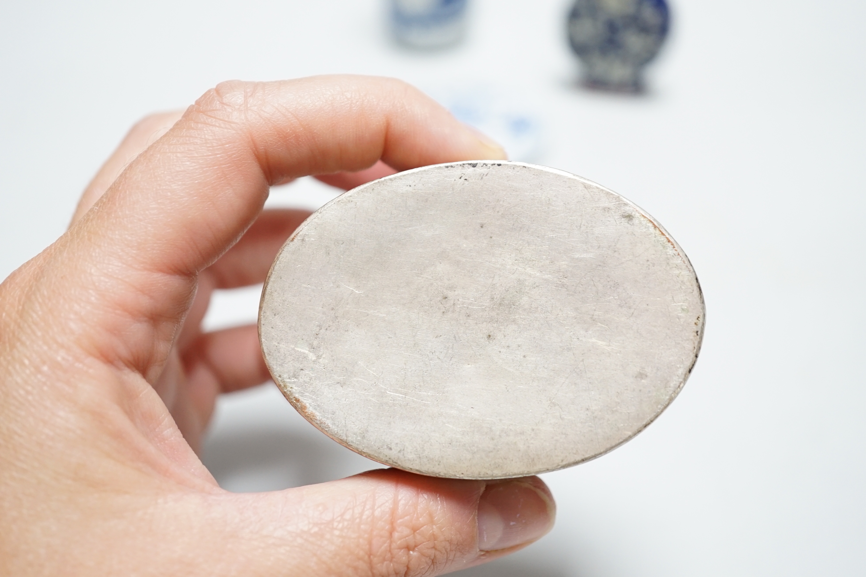 Two Chinese snuff bottles, a porcelain mounted white metal box, mother-of-pearl counters etc